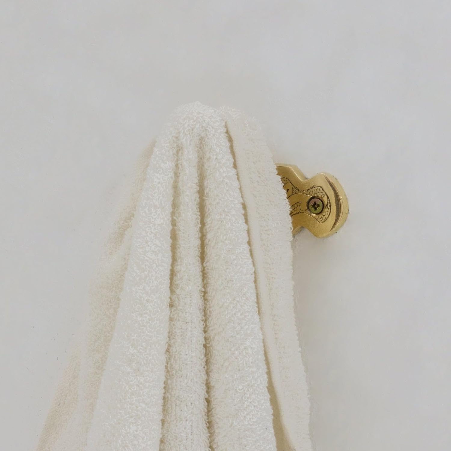 Antique coat hook styled in luxury entryway - In-Situ Styling